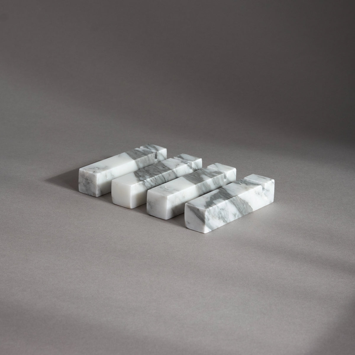 Marble-patterned rectangular blocks on a gray surface